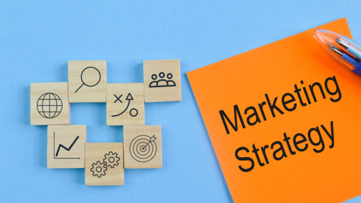Essentials of a digital marketing strategy with icons on blue background